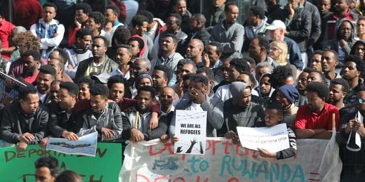 Protesters outside of the Rwandan Embassy African migrants protest threat to jail them unless they leave