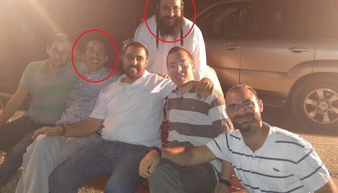 Raziel Shevach (standing) pictured with Itamar Ben-Gal (second from left) at the birthday celebration of Aviad Sharara (center) Bonded by tragedy, widow reaches out to her 'new sister'