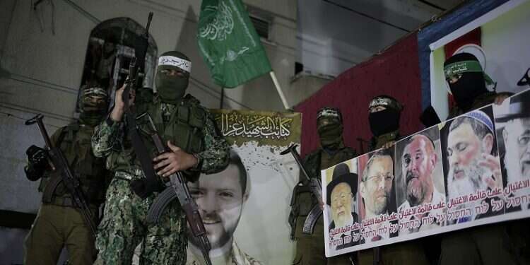 Threatening Hamas posters feature murdered Israelis alongside living politicians