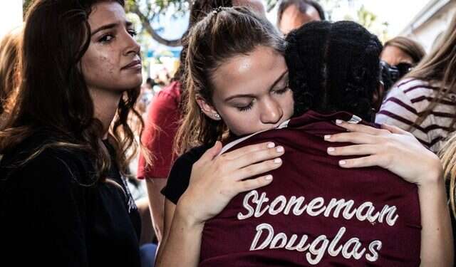 Students from Marjory Stoneman Douglas High School at a memorial following Wednesday's massacre of 17 of their schoolmates Israeli students and parents recount horror of Florida massacre