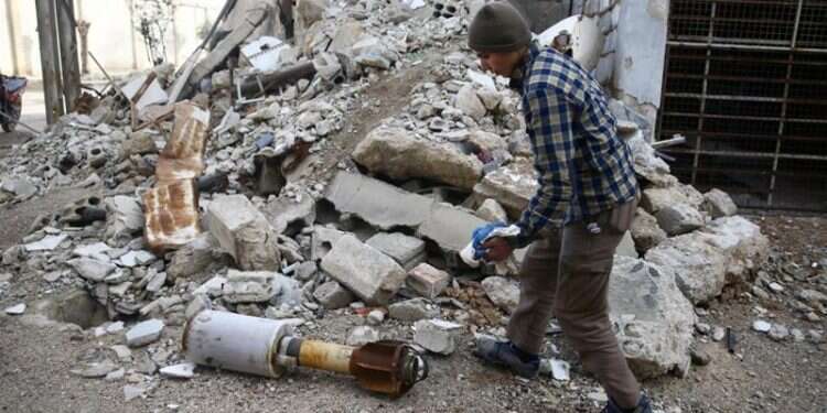 Syrian rights group: Bombing near Damascus kills over 100 in one day