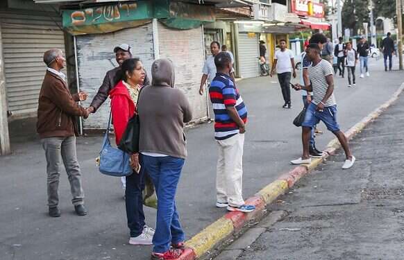 Migrants from Africa on the streets of south Tel Aviv Israel abandons plan to forcibly deport illegal African migrants