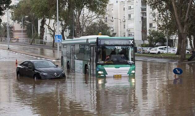 A flooded street in Haifa Bedouin teen dies in flash flood in desert; rare storm causes heavy damage