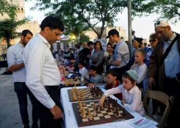 Former world champions take on dozens of chess players in Jerusalem