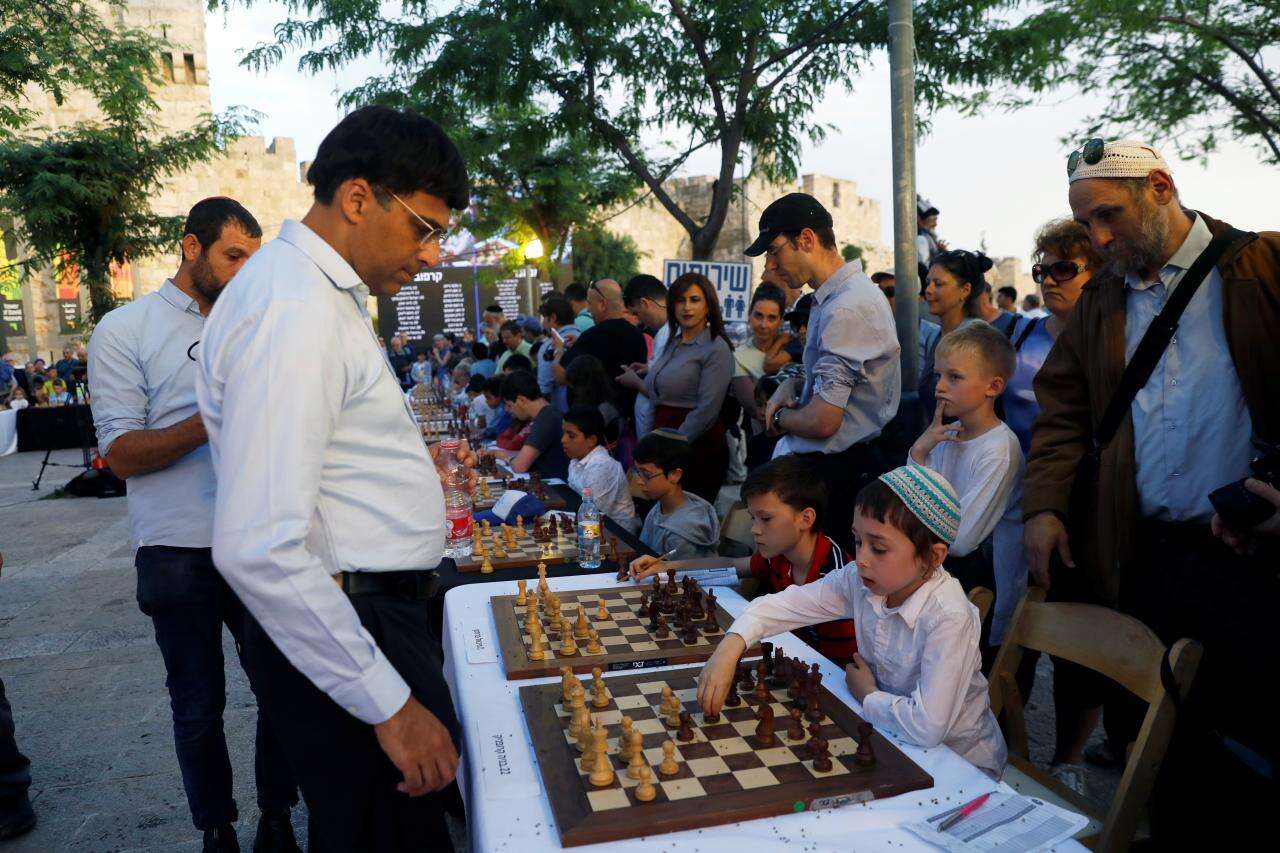 Former world champions take on dozens of chess players in Jerusalem –