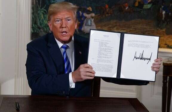 U.S. President Donald Trump shows a signed presidential memorandum after delivering a statement on the Iran nuclear deal on Tuesday A declaration of independence