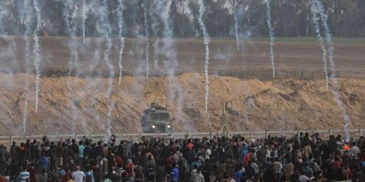 Israeli troops fire tear gas at Palestinian rioters during clashes near the Gaza border US foils anti-Israel Security Council move over deadly Gaza riots