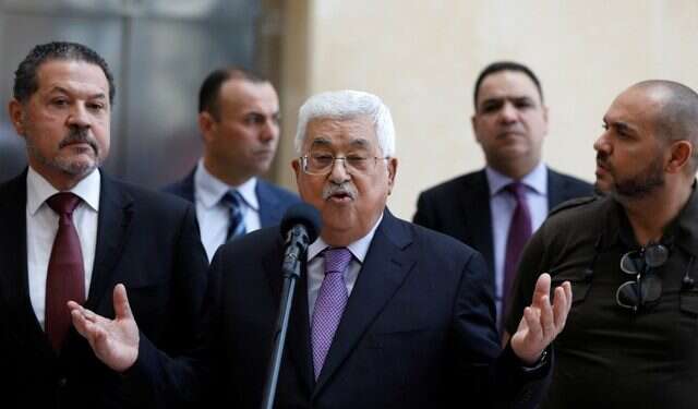 Palestinian Authority President Mahmoud Abbas talks to reporters after leaving the hospital PA leader on the mend, released from hospital, doctors say