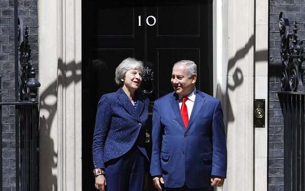 Britain's Prime Minister Theresa May greets Prime Minister Benjamin Netanyahu in London PM says he secured 'broad agreement' Iran must quit Syria