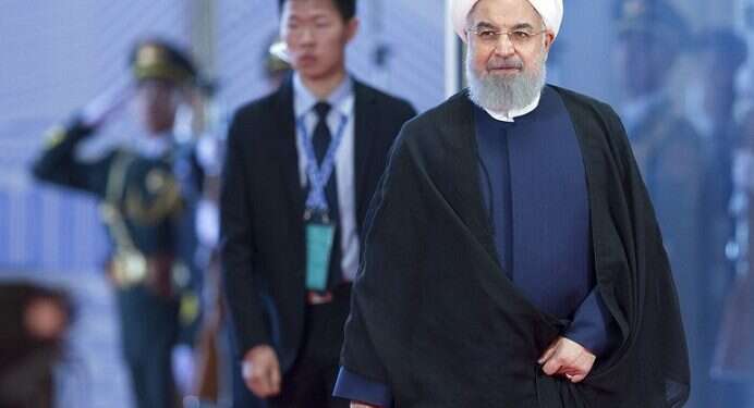 Iranian President Hassan Rouhani arrives at the Shanghai Cooperation Organization Summit in Qingdao in eastern China's Shandong Province Iran's Rouhani criticizes US 'unilateralism' over nuclear deal