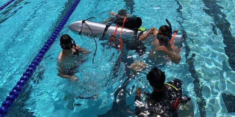 SpaceX engineers test the 'kid-sized submarine' SpaceX tests tiny submarine to help rescue Thai boys trapped in cave