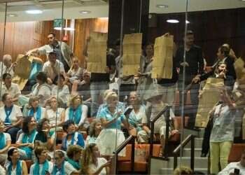 Minister defends nation-state law as Knesset session erupts in protest