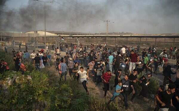 Palestinian protesters at Erez crossing Palestinian riot prompts IDF to shutter Gaza's main pedestrian border crossing