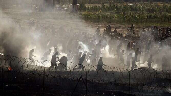 Palestinian rioters on the Gaza-Israel border IDF strikes Gaza arson terror cell as border tensions escalate