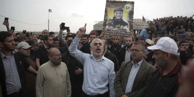 Hamas military leader Yahya Sinwar in a Gaza rally Hamas says renewed efforts to strike Gaza truce underway