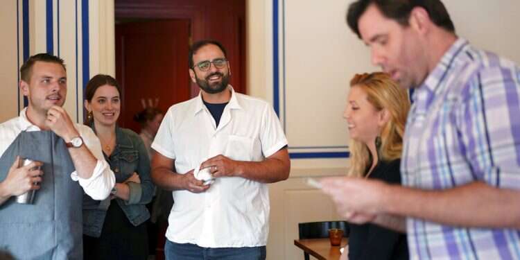 Alon Shaya (center) listens as manager Chuck Worley (right) addresses employees at Saba restaurant in New Orleans Israeli chef aims for kindness in new restaurant in New Orleans