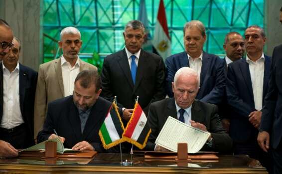 The heads of rival Palestinian factions Fatah and Hamas sign a reconciliation agreement in 2017 Report: Hamas says it is willing to let PA back into Gaza