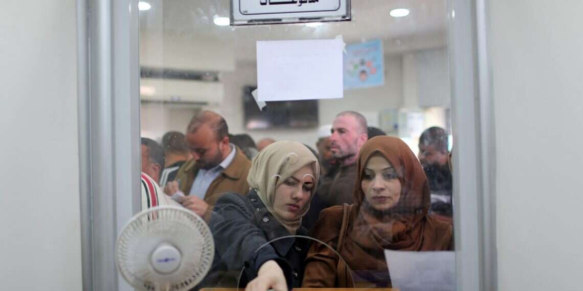 Hamas-hired employees receive their salaries thanks to Qatari aid Qatar transfers another $15 million in aid funds to Gaza 