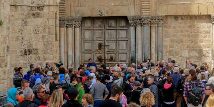 Tourists at the Church of the Holy Sepulchre Incoming tourism reaches all-time high, statistics agency says