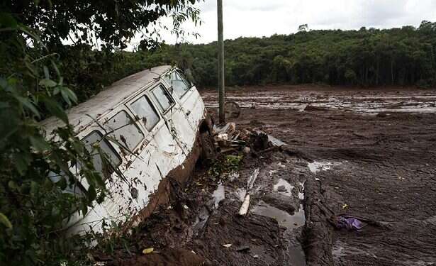 A van is seen in half buried in the mud after a dam collapse near Brumadinho Israel sending search and rescue team to Brazil after dam bursts