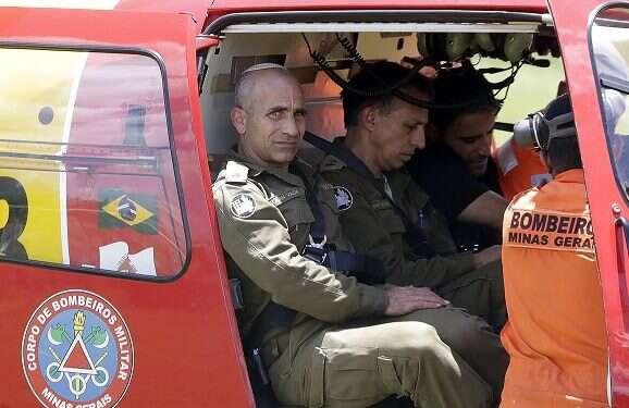 Rescuers and firefighters search for victims four days after a dam collapsed at an iron ore mine in Brazil |