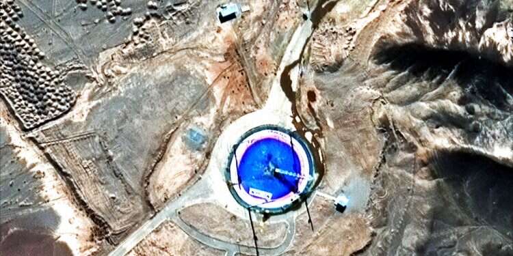 This Feb. 6 Iran reveals missile, shows off underground factory