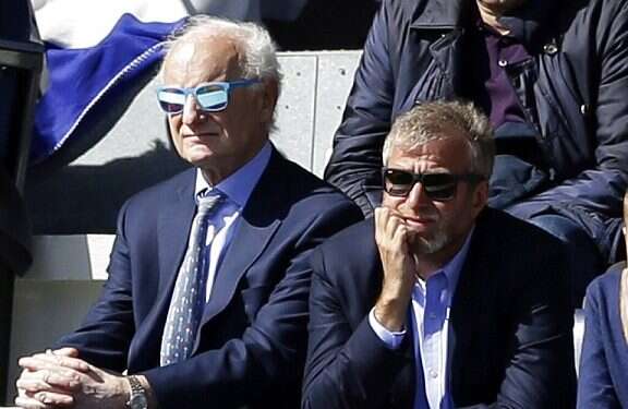 Chelsea chairman Bruce Buck and Chelsea owner Roman Abramovich watch a match in London Tottenham soccer club defends fans' use of chant 'Yid Army'