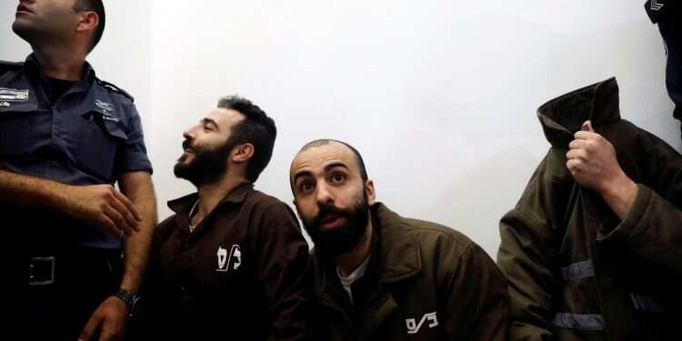 Romain Franck with co-defendants in court last March Israel sentences Frenchman to 7 years for smuggling Palestinian guns