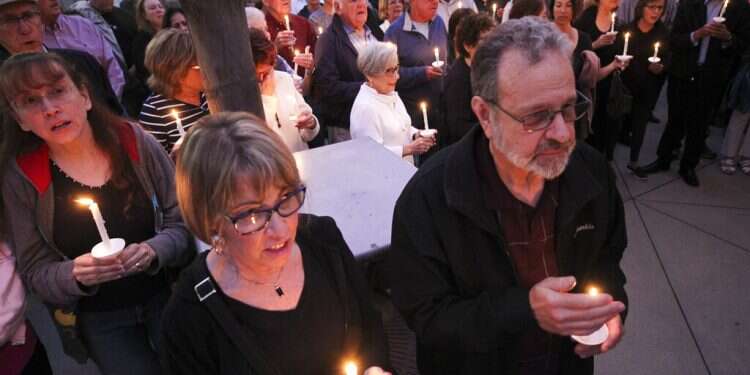People from the community, many of them of various faiths, join members of the Rancho Bernardo Community Presbyterian Church in a candlelight vigil for the Chabad of Poway synagogue shooting victims at the Rancho Bernardo Community Presbyterian Church in San Diego, Saturday Chabad worried about more anti-Semitic terror attacks