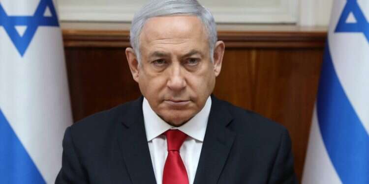 Prime Minister Benjamin Netanyahu at the start of the cabinet session on Sunday Prime minister orders troop increase in the wake of deadly rocket attack