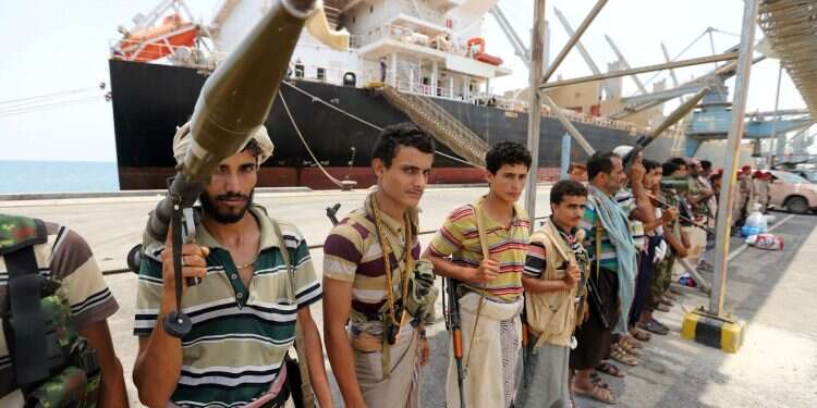 Members of the Houthi movement are seen during withdrawal from Salif port in Hodeida province, Saturday Yemen government dismisses rebel withdrawal from ports as 'farce'