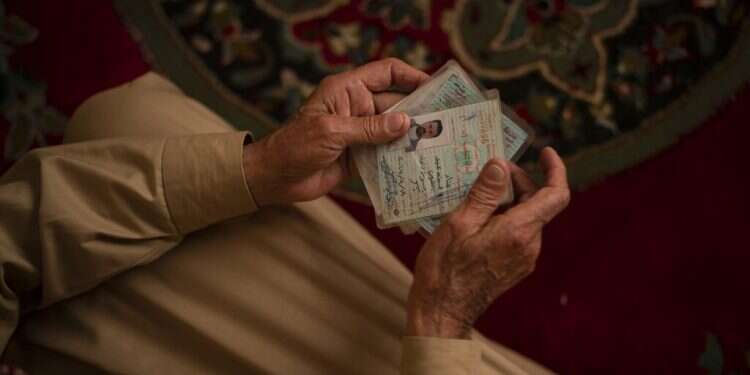 Hussein Abd holds the ID cards of his three sons, who were killed by Islamic State terrorists in an attack in January. 'Caliphate' gone, but militants in Iraq strike from hiding