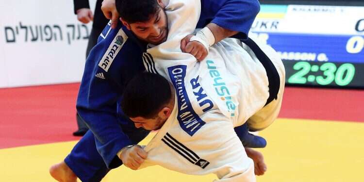 Israeli judoka Ori Sasson, in blue, competes in the Grand Prix in January Iranian Judo Federation ends boycotts of Israeli judoka