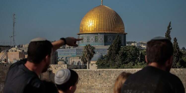 Jewish visitors look at the Temple Mount from a distance High Court to review decision to close Temple Mount on Jerusalem Day