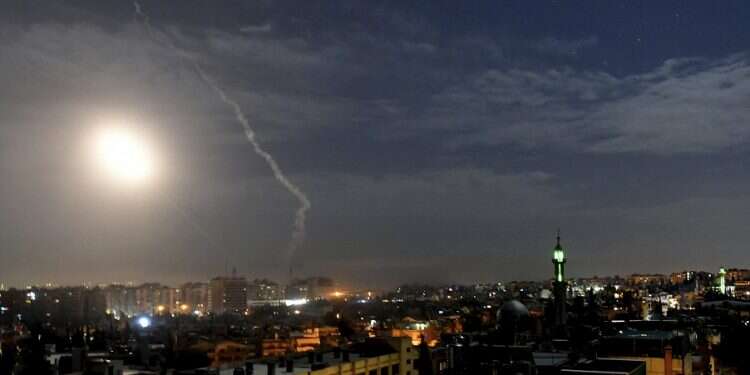 Missiles fly over Damascus during an alleged previous Israeli airstrike, January 21, 2019 Report: For 2nd straight day, Israel strikes military targets in Syria