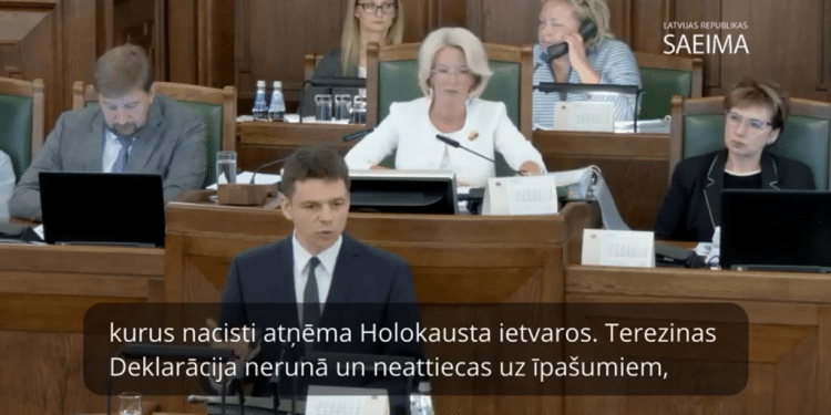 Lawmakers debate the Jewish property restitution bill in the Latvian parliament Latvian parliament freezes Jewish restitution bill following Israel Hayom report