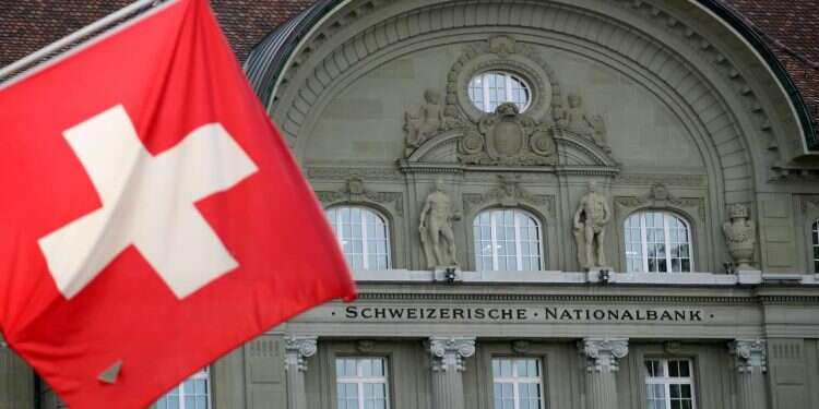A Swiss flag is pictured in front of the Swiss National Bank in Bern, Switzerland Israel seeks Swiss help in overseas tax crackdown