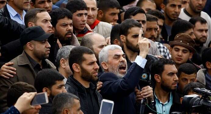 Hamas leader Yahya Sinwar shouts slogans as he takes part in a tent city protest near the border with Israel 'Iran trying to take over Gaza,' IDF official warns Palestinians