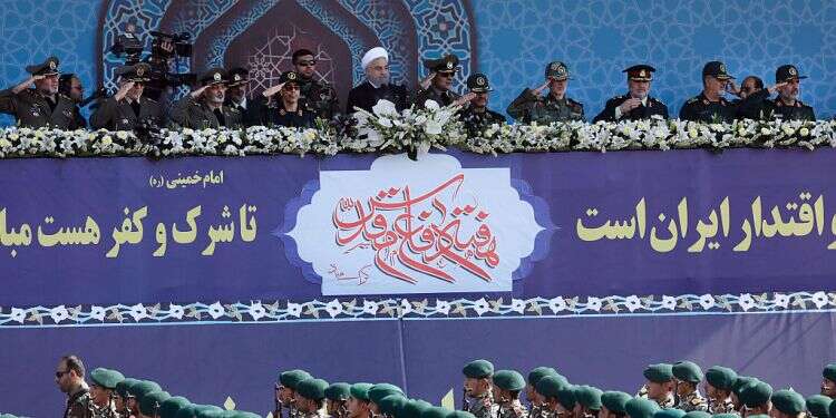 Iranian soldiers march during the annual military parade Shin Bet: Iranian-led network tried to recruit operatives in Israel