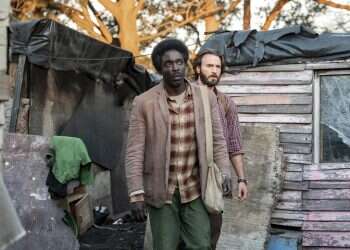 Michael Kenneth Williams, foreground, and Chris Evans in a scene from 'The Red Sea Diving Resort' Review: Netflix sinks low with 'The Red Sea Diving Resort'