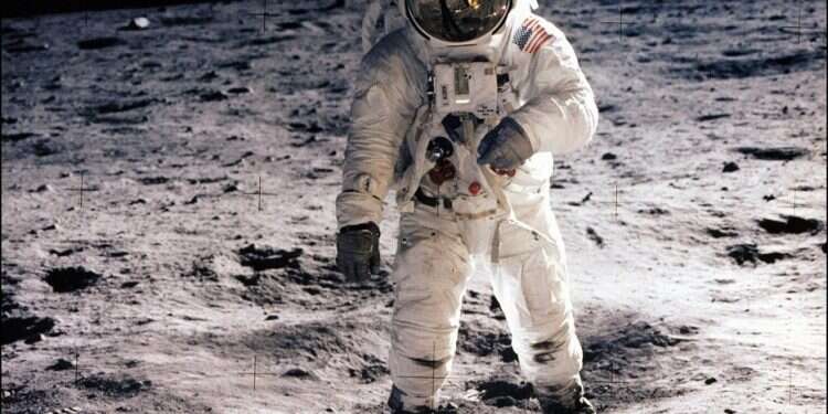 Astronaut Edwin (Buzz) Aldrin Jr. walking on the surface of the moon near the leg of the Eagle lunar module during the Apollo 11 extravehicular activity on July 20, 1969