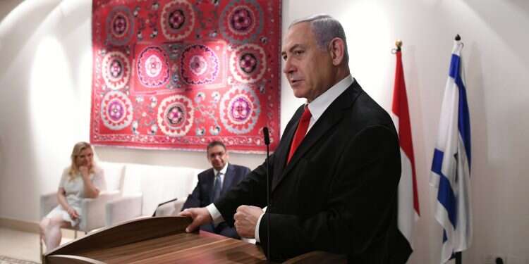 Prime Minister Benjamin Netanyahu speaking at Egypt's national day event Wednesday. Pictured in the background: Sara Netanyahu and Egyptian Ambassador Khaled Azmi PM praises Egyptian president, calls him 'friend and colleague'