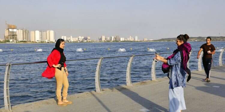 In Iran, some take off their hijabs as hard-liners push back