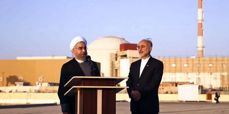 Iranian President Hassan Rouhani, left, speaks as he is accompanied by the head of Iran's Atomic Energy Organization, Ali Akbar Salehi, on a visit to the Bushehr nuclear power plant on Jan. 13, 2015 'Iran has begun its march toward nuclear weapons'