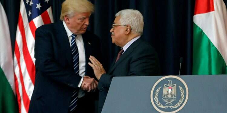 US President Donald Trump shakes hands with Palestinian Authority President Mahmoud Abbas during a joint press conference in Bethlehem in 2017 Kushner: Trump is 'very fond' of Abbas, willing to engage on peace