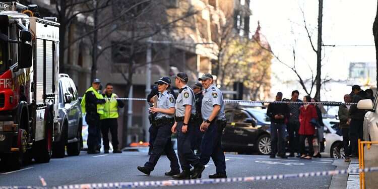 Police officers investigate a scene following a stabbing in Sydney, Australia, August 13, 2019 Police looking into motive after deadly rampage in downtown Sydney