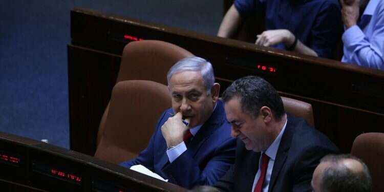 Prime Minister Benjamin Netanyahu with Foreign Minister Yisrael Katz at the Knesset plenum Foreign Ministry officials: FM Yisrael Katz is a 'puppet'