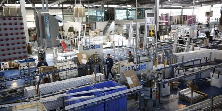 Palestinian workers at Aluminum Construction, a factory in the Maaleh Adumim Industrial Park, February 3, 2016 (Illustrative) Republican delegation meets Israeli, Palestinian business leaders week after Tlaib, Omar banned