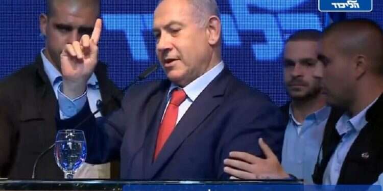 Prime Minister Benjamin Netanyahu is seen being escorted out of a Likud campaign rally in Ashdod, Tuesday Likud blasts Blue and White for 'gloating' over PM's evacuation in rocket attack