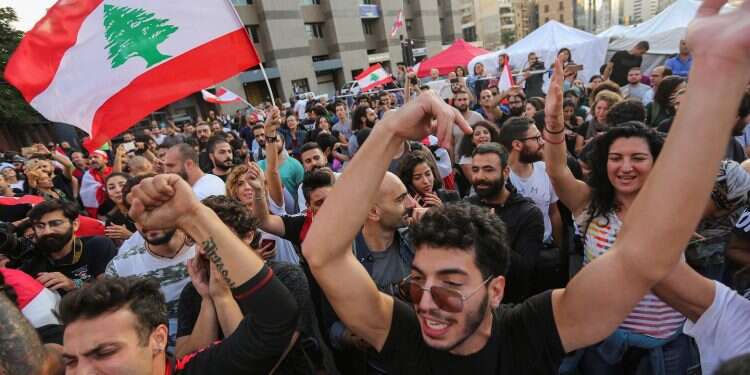 Protestors celebrate after Lebanon's Prime Minister Saad al-Hariri announced his resignation in Beirut, Lebanon October 29, 2019. REUTERS/Aziz Taher 'The people of Lebanon want an effective government, end to corruption'